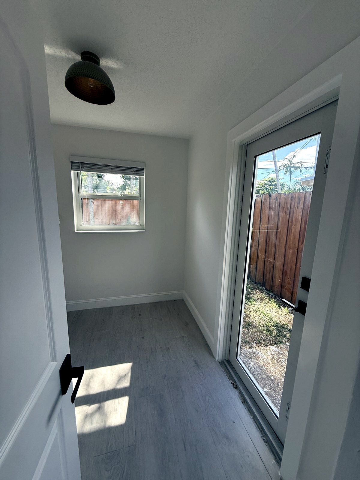 New construction room with glass doors to yard